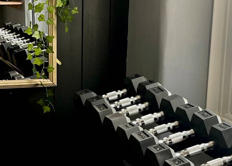 A rack of dumbbells at The Galpals Collective - Douglas, Isle of Man, offers fitness elegance in Douglas, Douglas, IM.