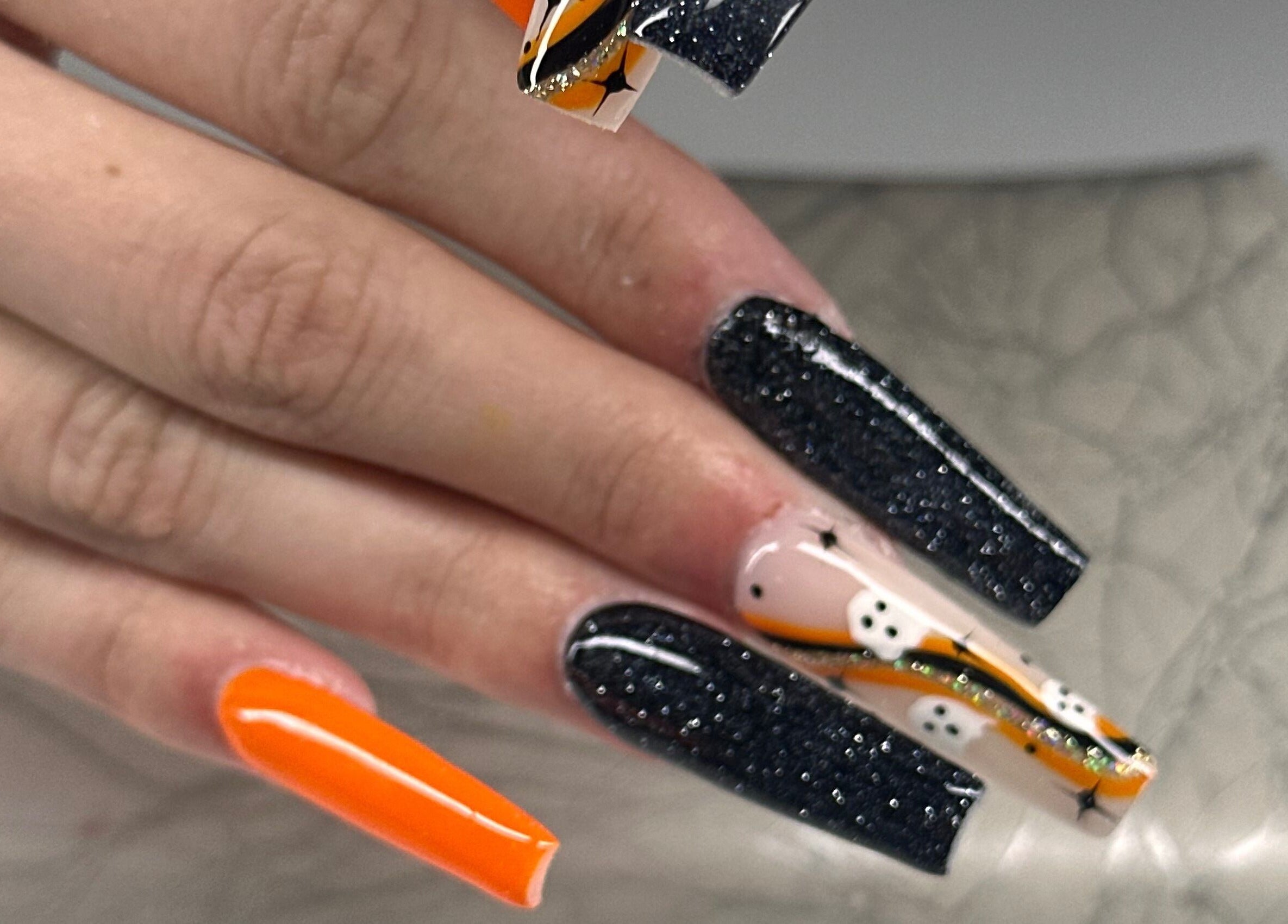 Spooky black and orange Halloween nail art at Honey & Clove Nails, Sylvan Lake, Alberta, CA.