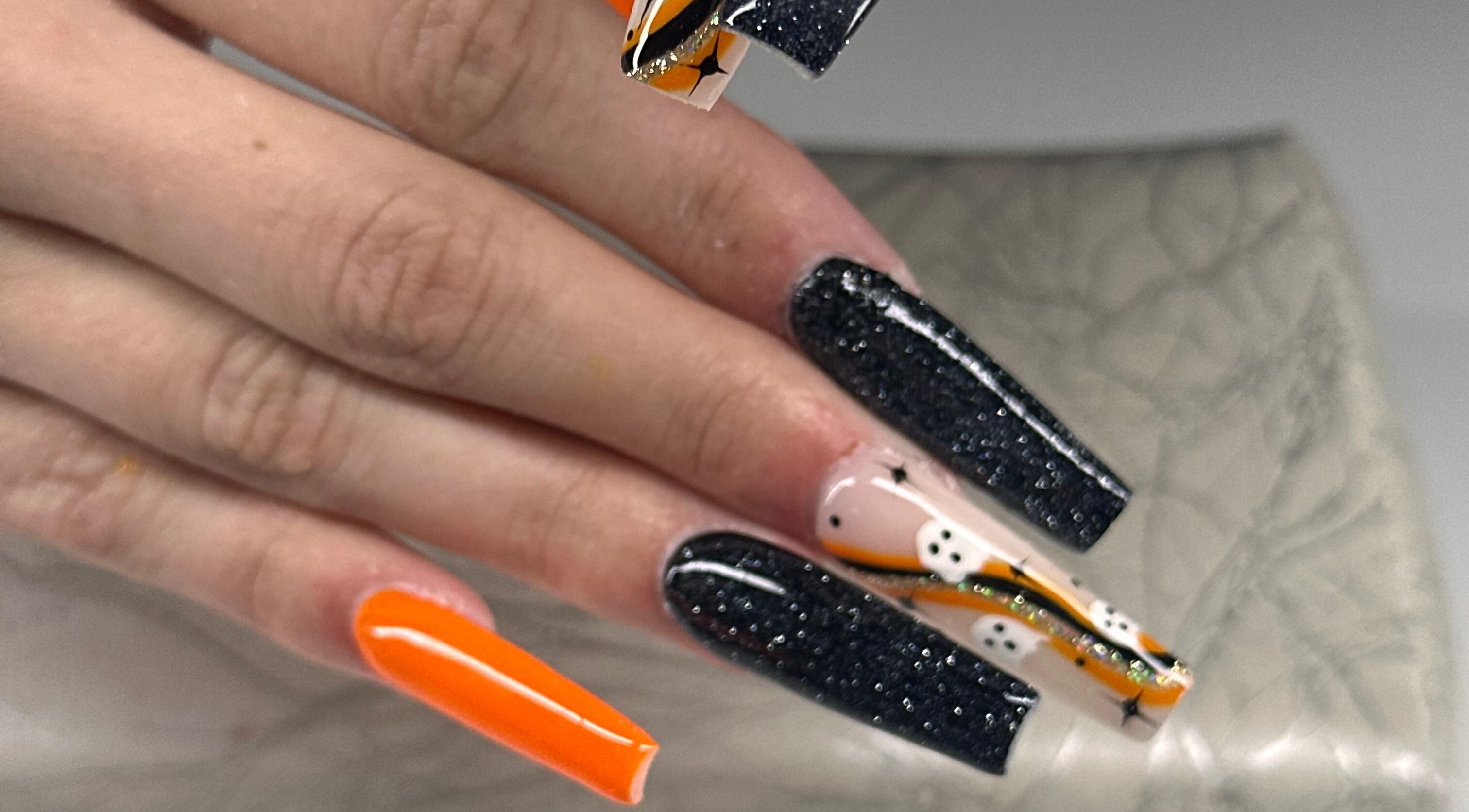 Spooky black and orange Halloween nail art at Honey & Clove Nails, Sylvan Lake, Alberta, CA.