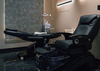 Comfortable reclining chair at Generation Gentleman Barbershop, Dubai, AE, offering premium grooming services.