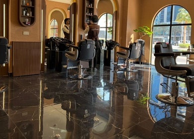 Elegant interior of Generation Gentleman Barbershop, دبي, دبي, AE, featuring sleek barber chairs and stylish design.