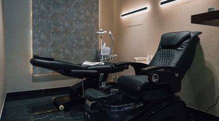 Luxurious barber chair at Generation Gentleman Barbershop, Dubai, AE, showcases sleek design and comfort.