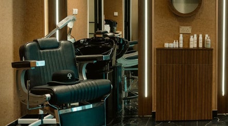 Elegant barber chair inside Generation Gentleman Barbershop, Dubai, AE, showcasing modern interior design.