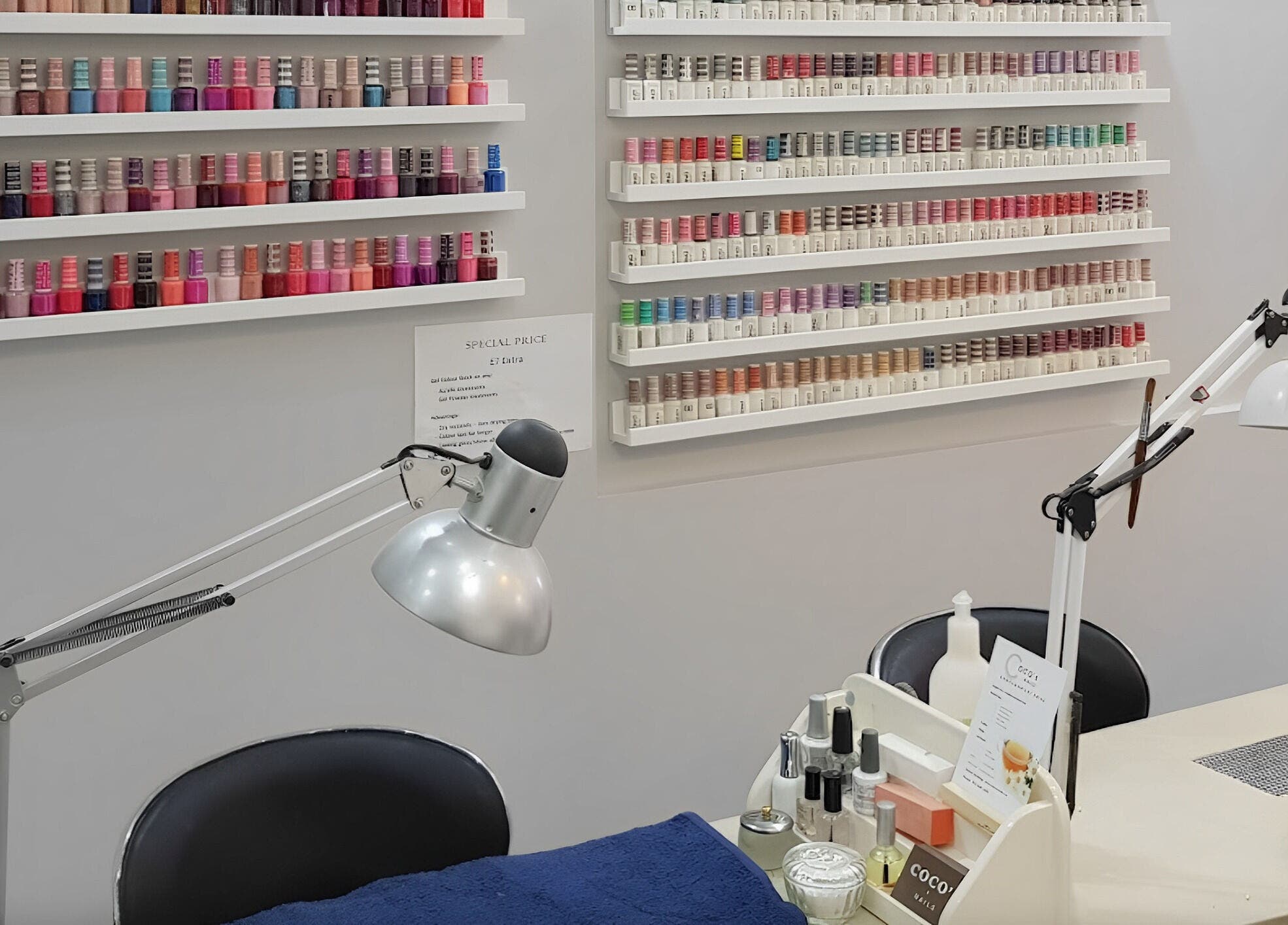 Coco's Nails in Basingstoke, England showcases a vibrant nail polish display with modern workstations.