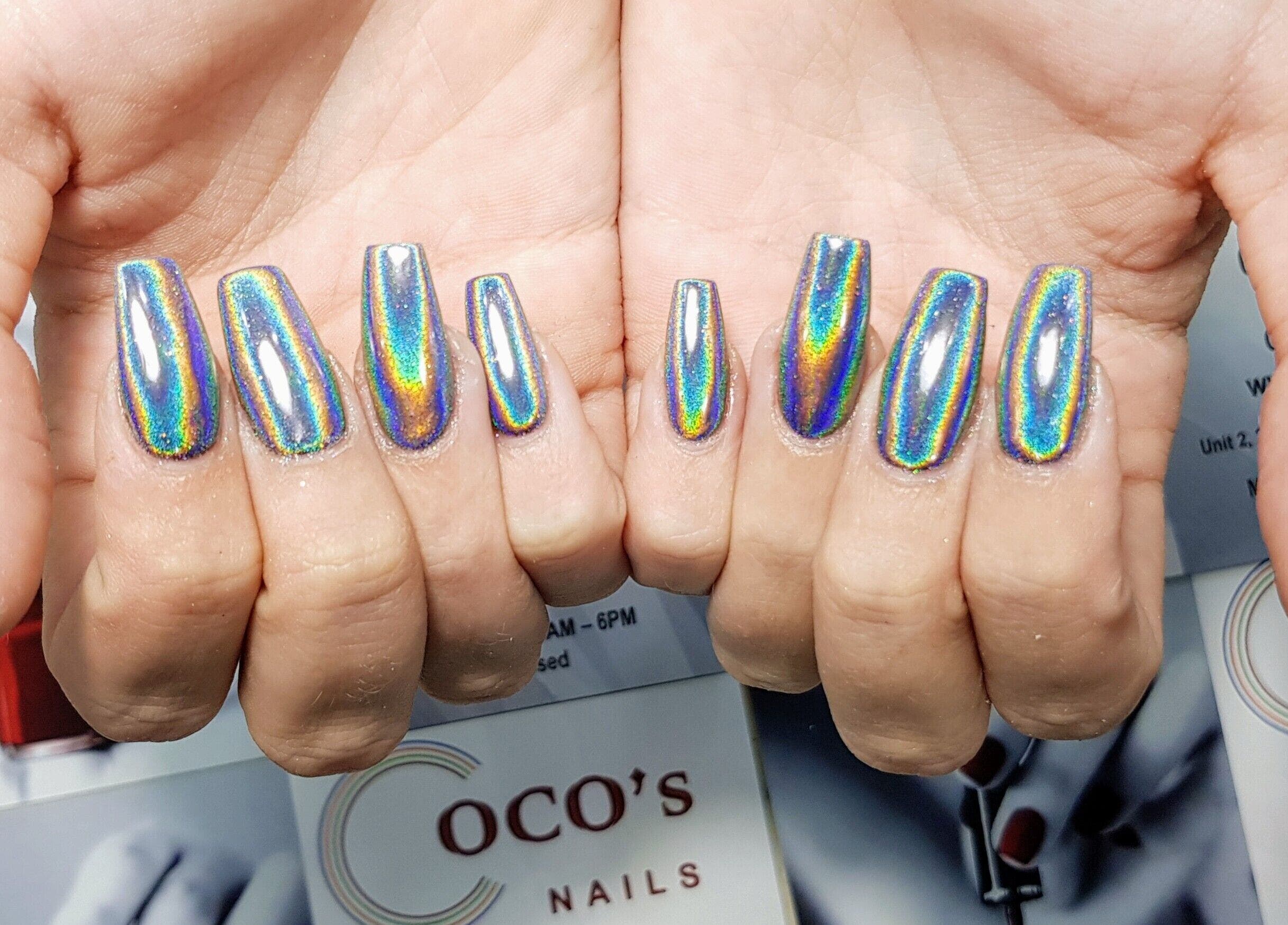Vibrant holographic nails at Coco's Nails, Basingstoke, England, GB, showcasing colorful nail art.