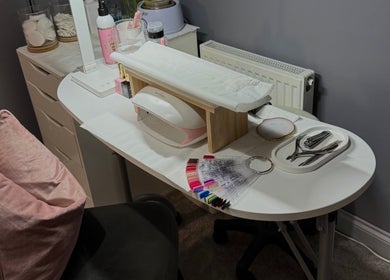 Chic nail station at Beauty By Caitlin, Chalford, England, GB, showcasing manicure tools and polish samples.