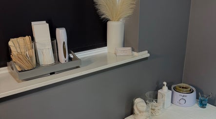 Beauty By Caitlin treatment supplies on display in Chalford, England, GB, showcasing a serene spa setup.