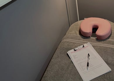 Beauty By Caitlin massage room with forms on table, Chalford, England, GB.