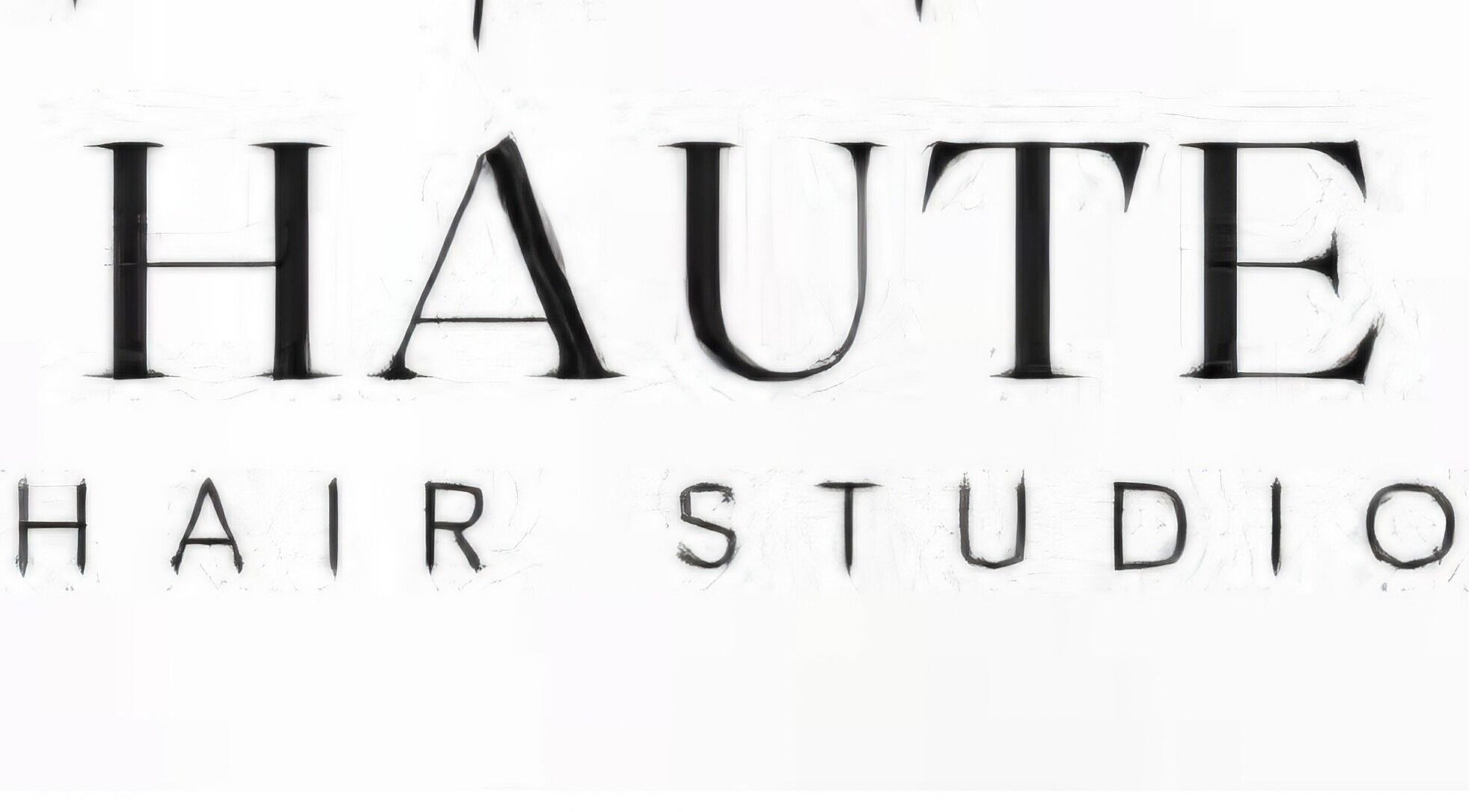 Signage of Haute Hair Studio in Matthews, North Carolina, US showcasing elegant typography.