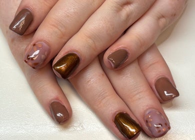 Stylish manicure with brown and gold hues at Bei Beauty, Ahoghill, Northern Ireland, GB.