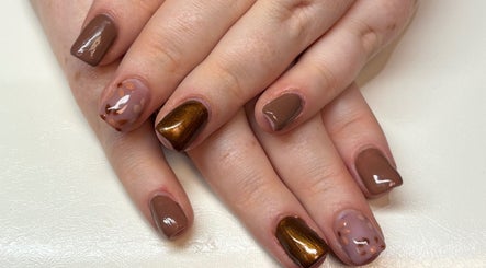 Stylish manicure with brown and gold hues at Bei Beauty, Ahoghill, Northern Ireland, GB.