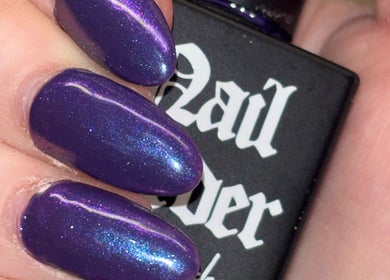 Vibrant violet nails with shimmer effect at Bei Beauty, Ahoghill, Northern Ireland, GB.