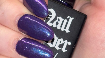 Vibrant violet nails with shimmer effect at Bei Beauty, Ahoghill, Northern Ireland, GB.
