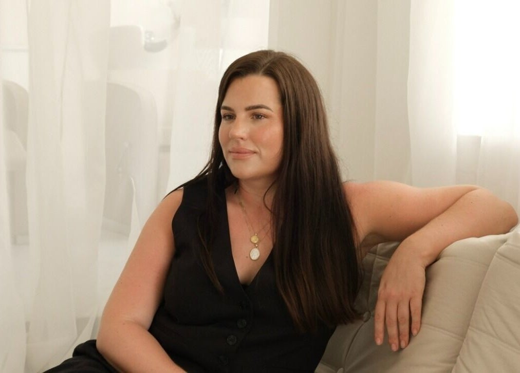 Woman relaxing at The Integrative Studio, Fairy Meadow, New South Wales, AU, exemplifying calm elegance.