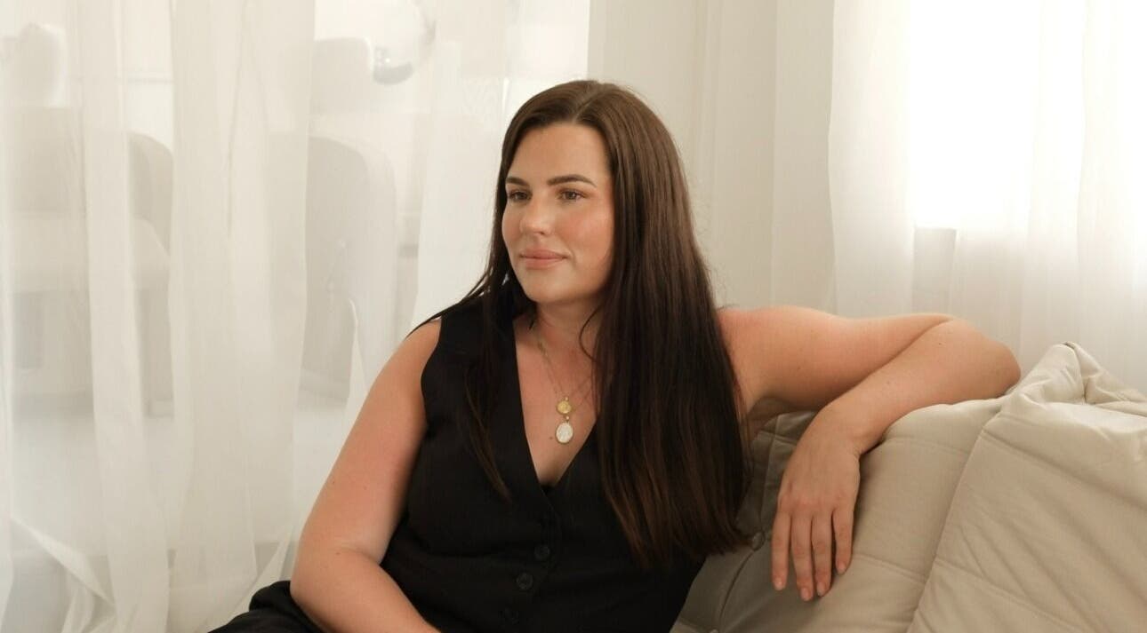 Woman relaxing at The Integrative Studio, Fairy Meadow, New South Wales, AU, exemplifying calm elegance.