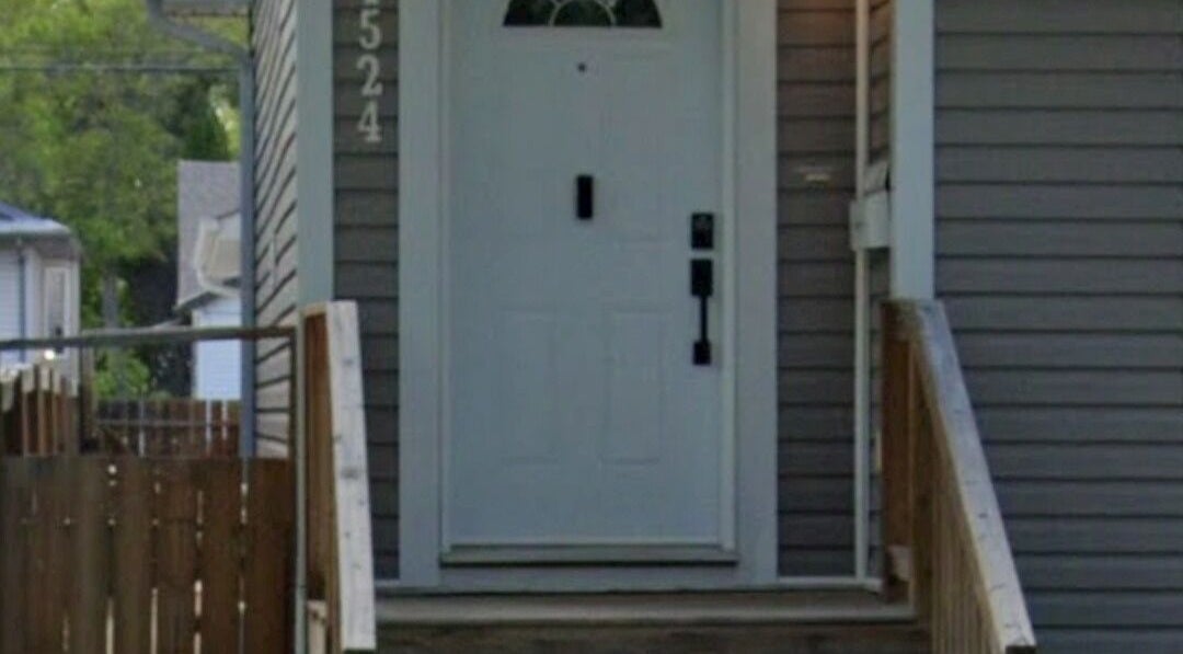 Front entrance of Sore Muscles Solution Ltd. in Edmonton, Alberta, CA, showcasing a charming doorway.