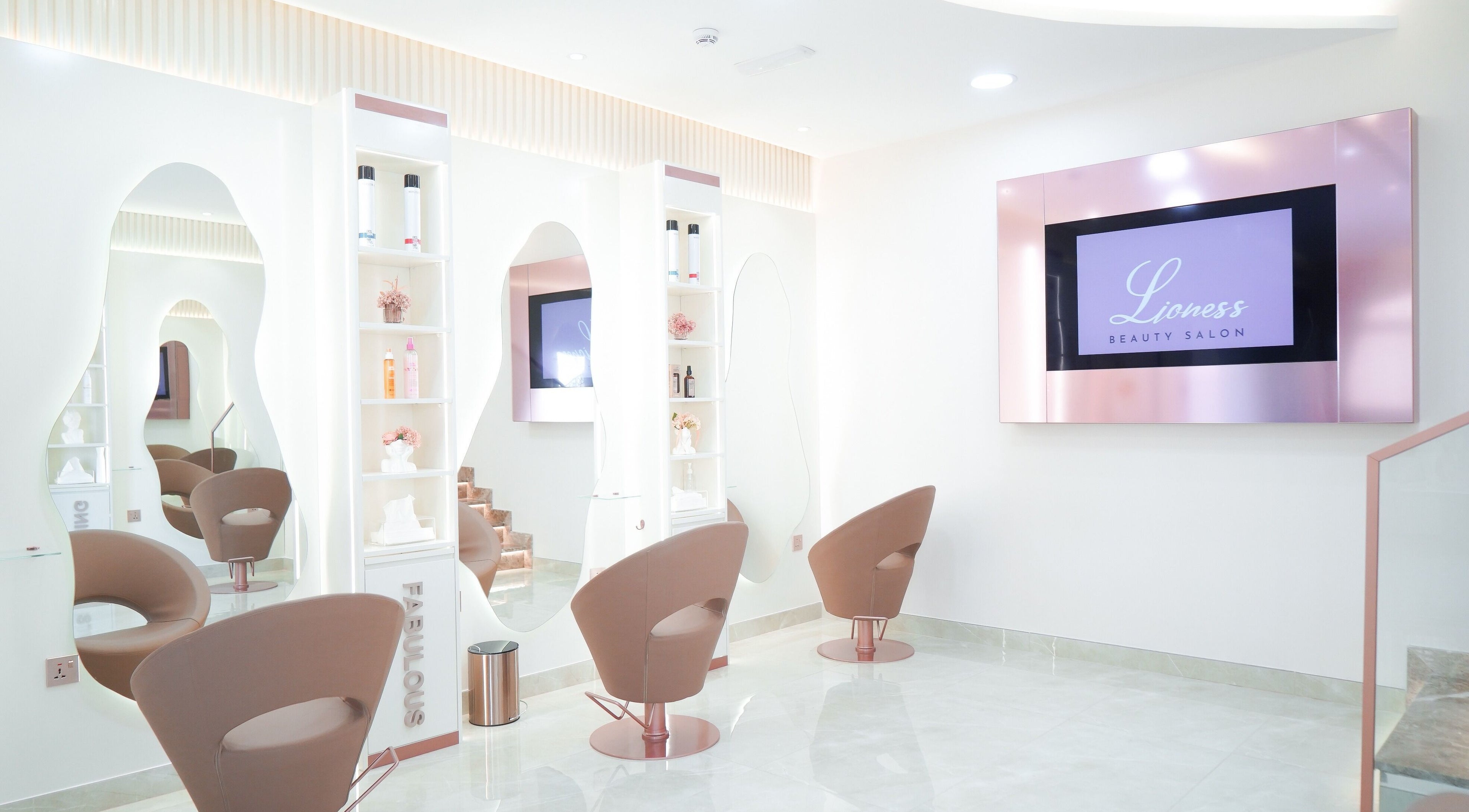 Chic interior of Lioness Beauty Salon in Dubai, Dubai, AE showcasing modern salon chairs and decor.