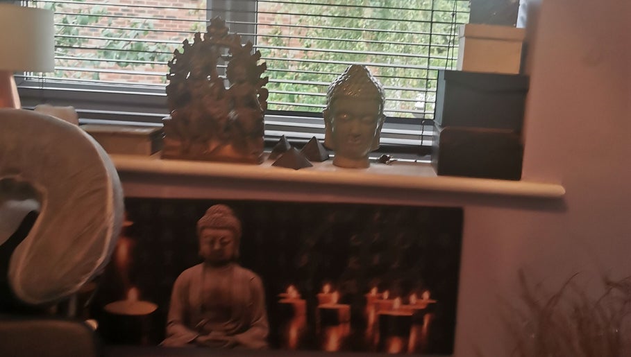 Buddha statues in a peaceful setting at Sanctuary Reflexology, York, England, GB, enhancing relaxation ambiance.