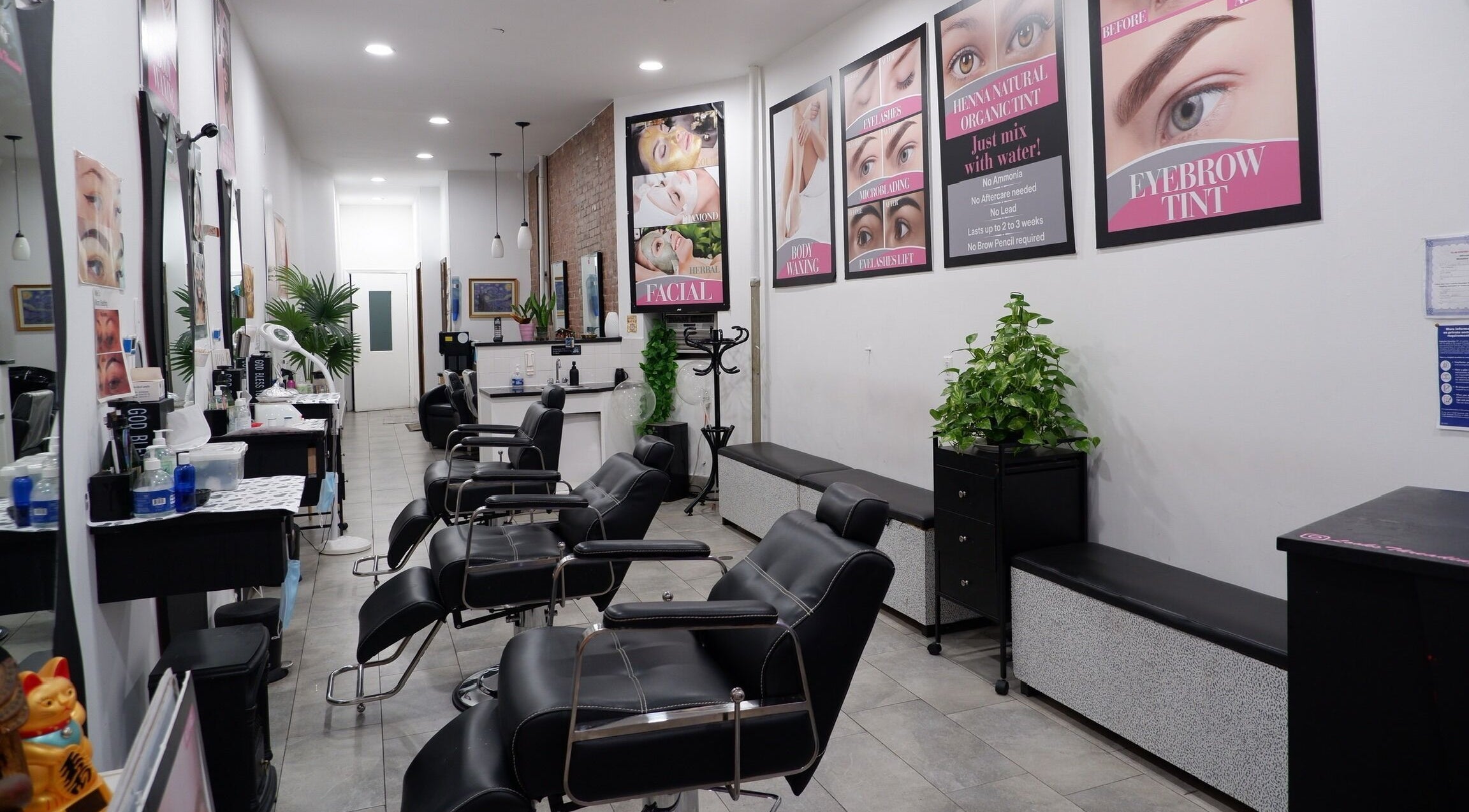 Interior of Looks Threading Beauty Salon in New York, US. Elegant chairs and decor create a welcoming atmosphere.