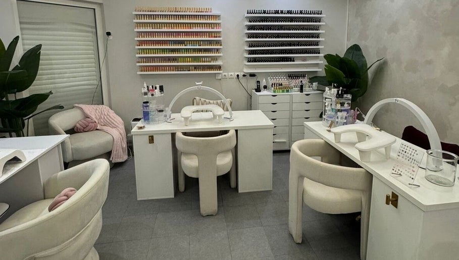 Chic nail studio at Le Getaway by Lexx, Marigot, GP with plush chairs and nail polish displays.