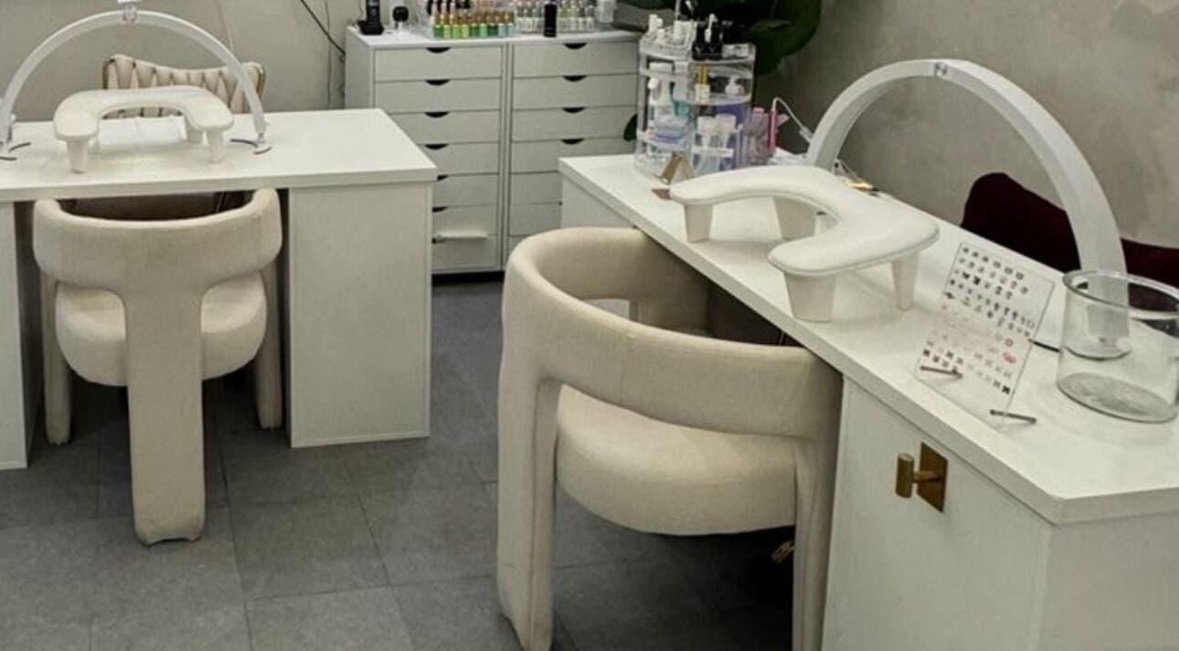 Elegant manicure stations at Le Getaway by Lexx in Marigot, GP, featuring plush chairs and nail care tools.