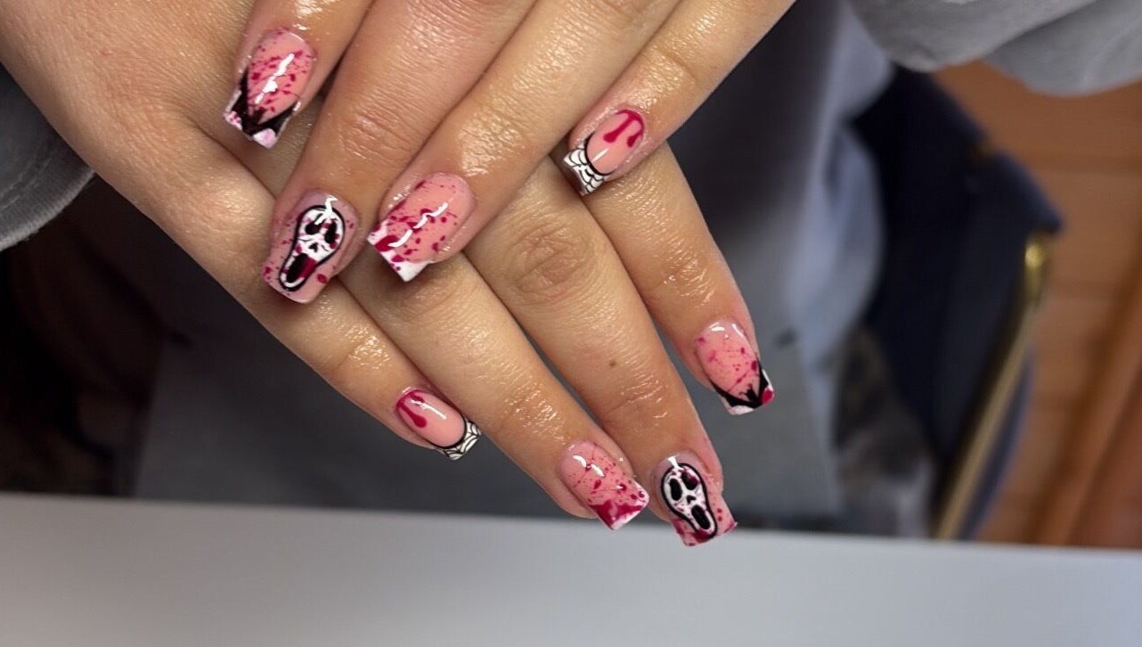Spooky horror-themed nail art at Glossed by Jorjah, Chelmsford, England, GB. Elegant design with red splatter details.