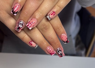 Spooky horror-themed nail art at Glossed by Jorjah, Chelmsford, England, GB. Elegant design with red splatter details.