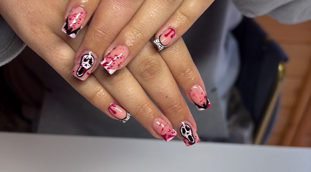 Spooky horror-themed nail art at Glossed by Jorjah, Chelmsford, England, GB. Elegant design with red splatter details.
