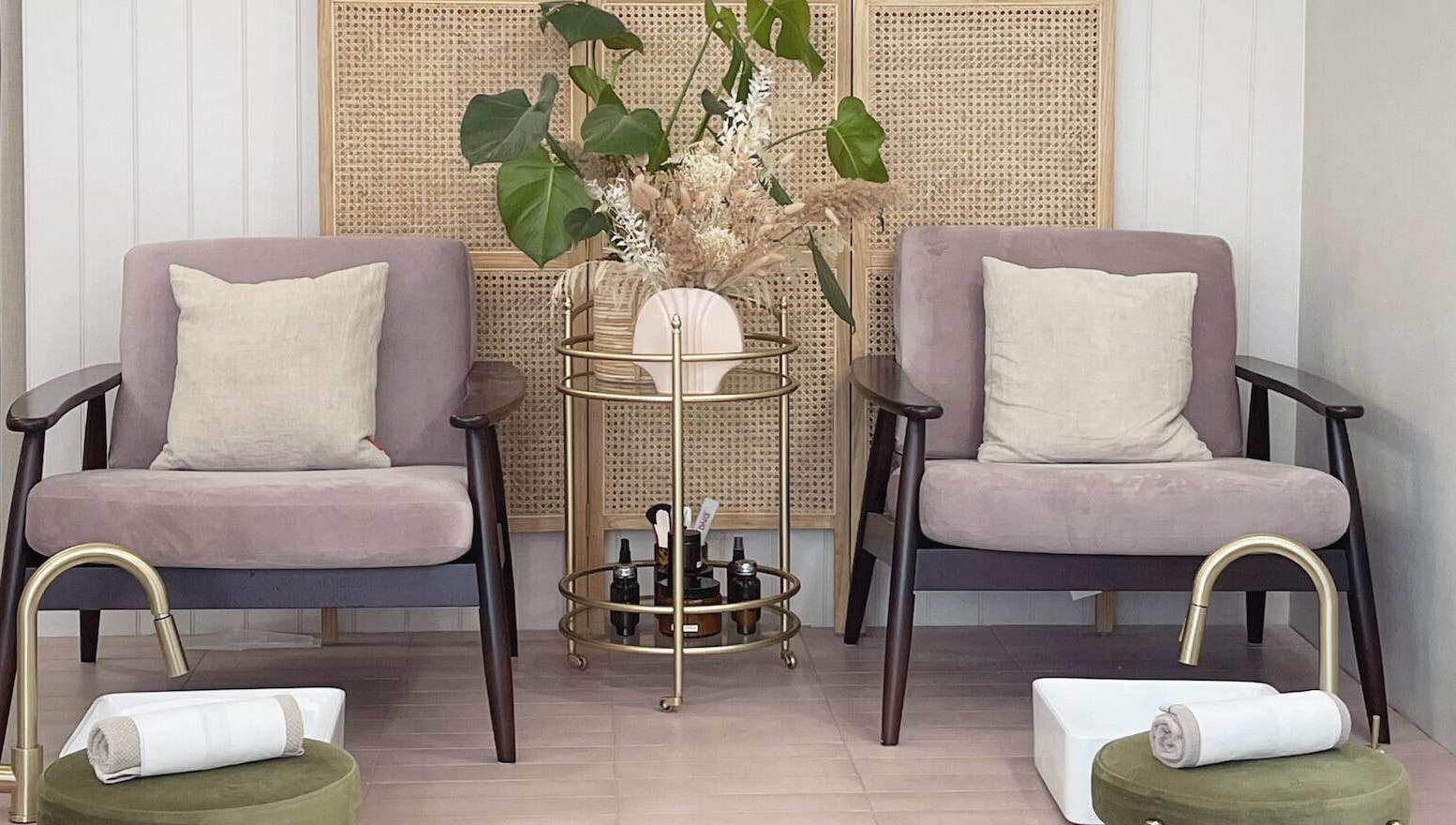 Pampering lounge at L&W Brixton | BIAB Nails & Brows, London, England. Cozy chairs with plants and pedicure setup.