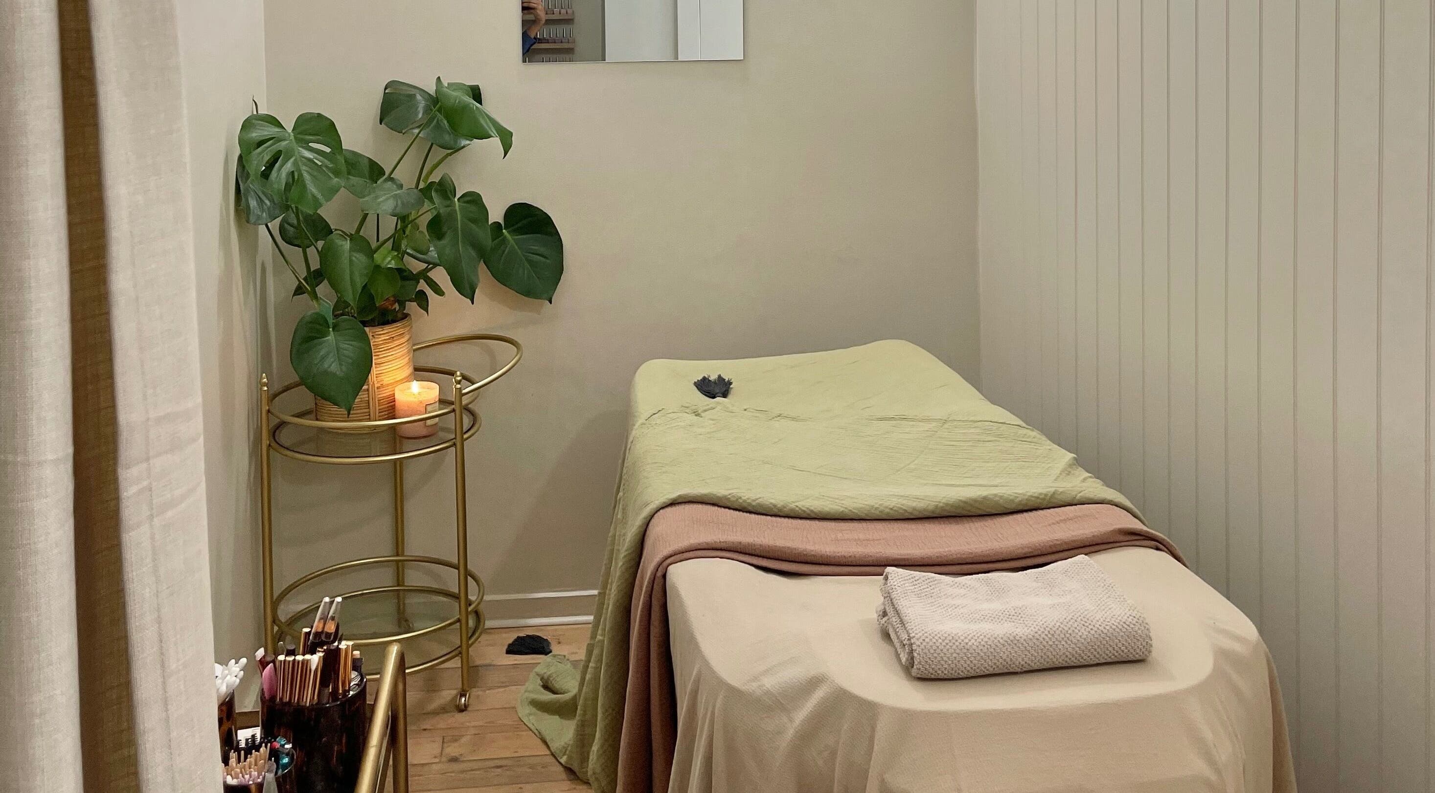 Calm treatment room at L&W Brixton | BIAB Nails & Brows, London, England, GB, with a massage table and plants.