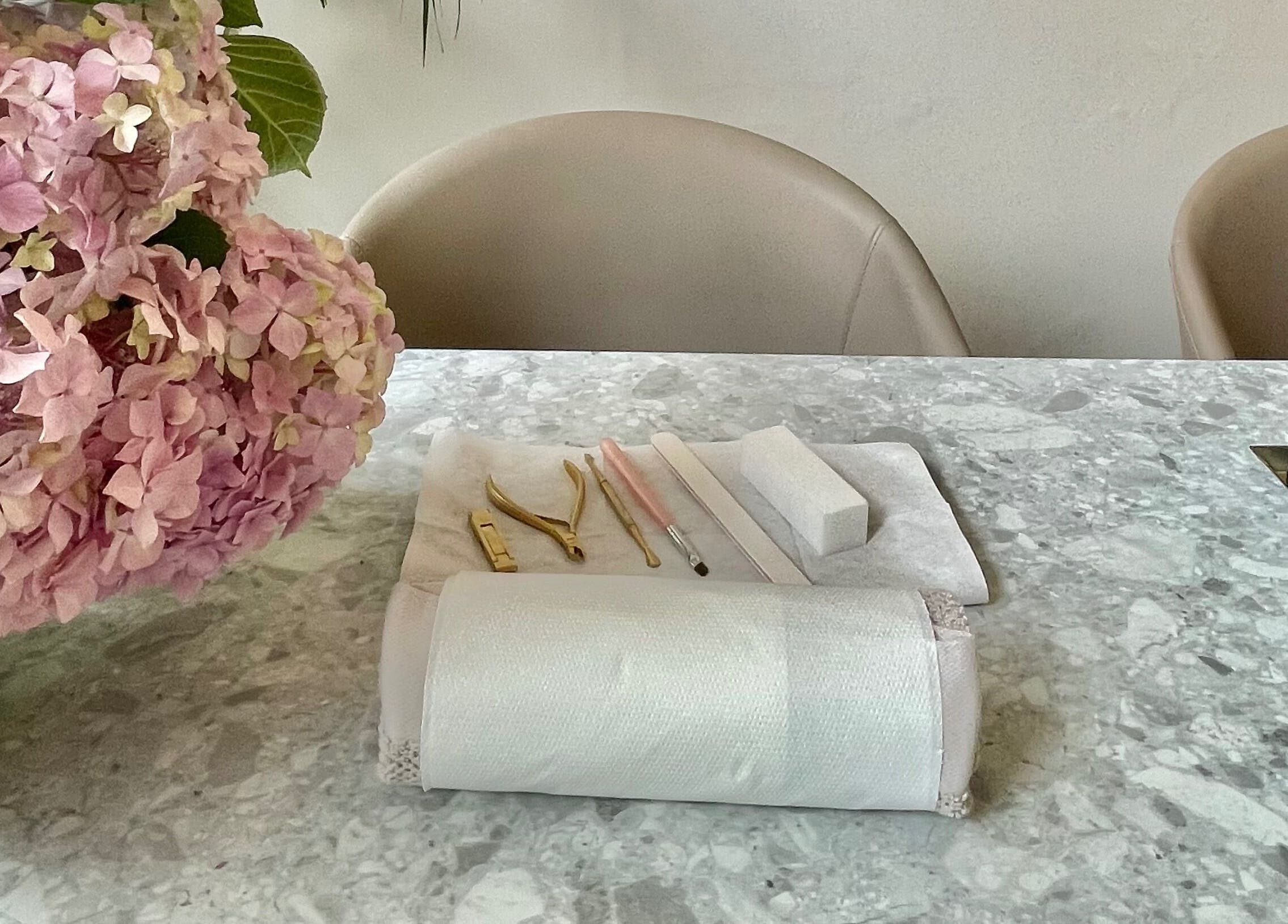L&W Brixton | BIAB Nails & Brows in London, England, GB, featuring a chic manicure setup with tools and flowers.