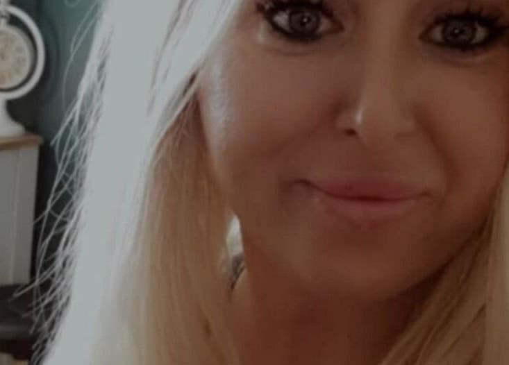 Smiling individual at Human Balance, a beauty venue in Glasgow, Scotland, GB creates a welcoming atmosphere.