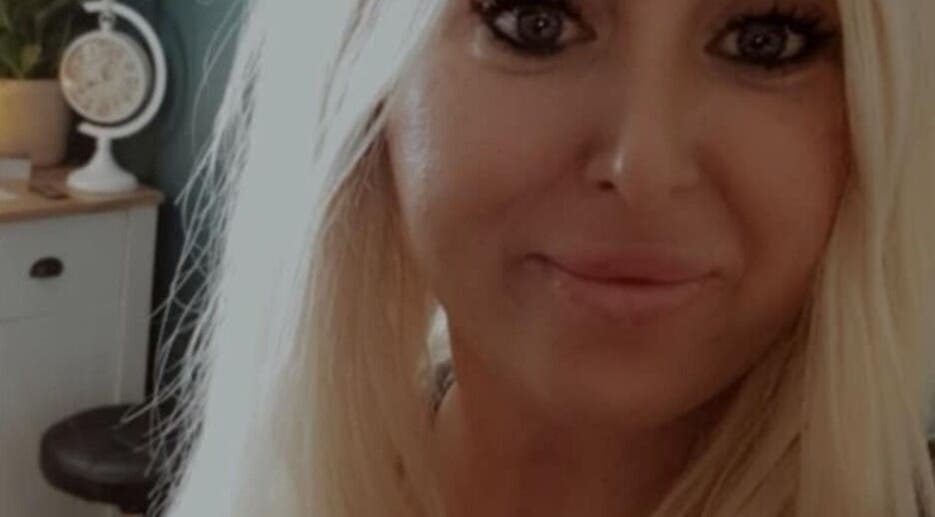 Smiling individual at Human Balance, a beauty venue in Glasgow, Scotland, GB creates a welcoming atmosphere.