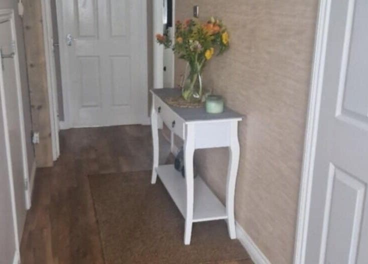 Stylish entryway decor at Human Balance in Glasgow, Scotland, GB featuring a flower vase.