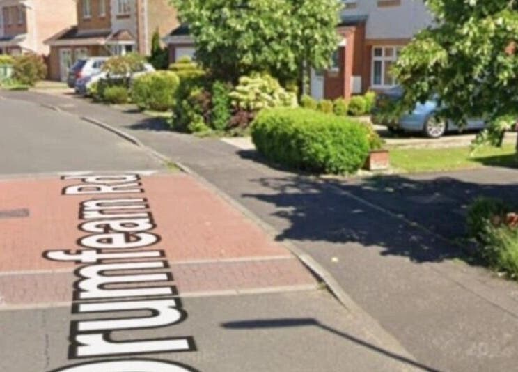 Street view near Human Balance, Glasgow, Scotland, GB, surrounded by greenery and parked cars.
