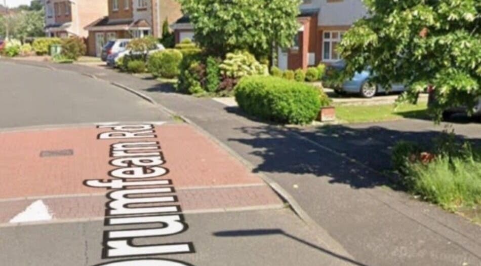Street view near Human Balance, Glasgow, Scotland, GB, surrounded by greenery and parked cars.