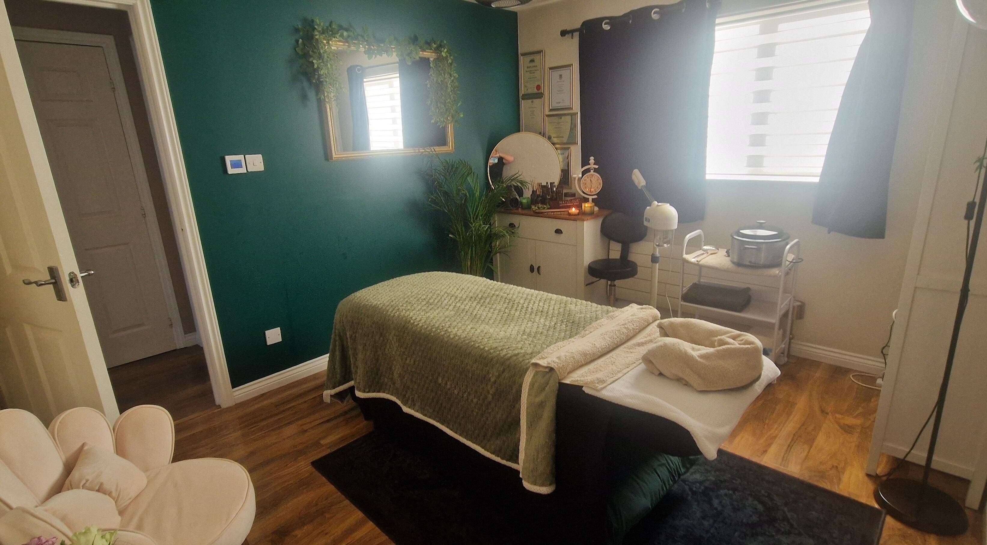 Tranquil massage room at Human Balance, Glasgow, Scotland, GB with plush bed and calming decor.