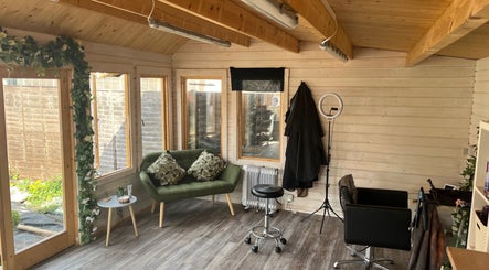 Cozy interior of Mrs Mabbley Hair Studios, Aldershot, England, GB featuring modern seating and decor.