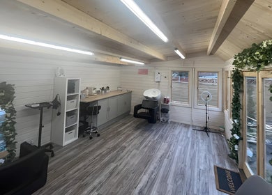 Chic interior of Mrs Mabbley Hair Studios, Aldershot, England, GB, featuring sleek decor and modern salon equipment.
