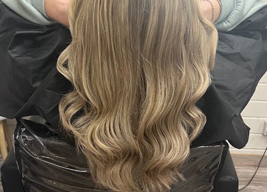 Blonde hair styled in waves at Mrs Mabbley Hair Studios, Aldershot, England, GB.
