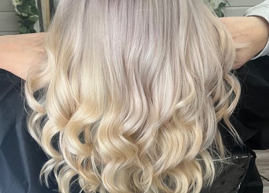 Blonde wavy hair styled at Mrs Mabbley Hair Studios in Aldershot, England, GB.