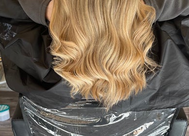Golden wavy hair styled at Mrs Mabbley Hair Studios, Aldershot, England, GB, showcasing expert hairstylist work.