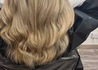 Voluminous blonde waves styled at Mrs Mabbley Hair Studios, Aldershot, England, GB.