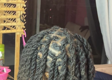 Intricate hair twists at Curl Pride GY, West Bank Demerara, GY showcasing expert styling.