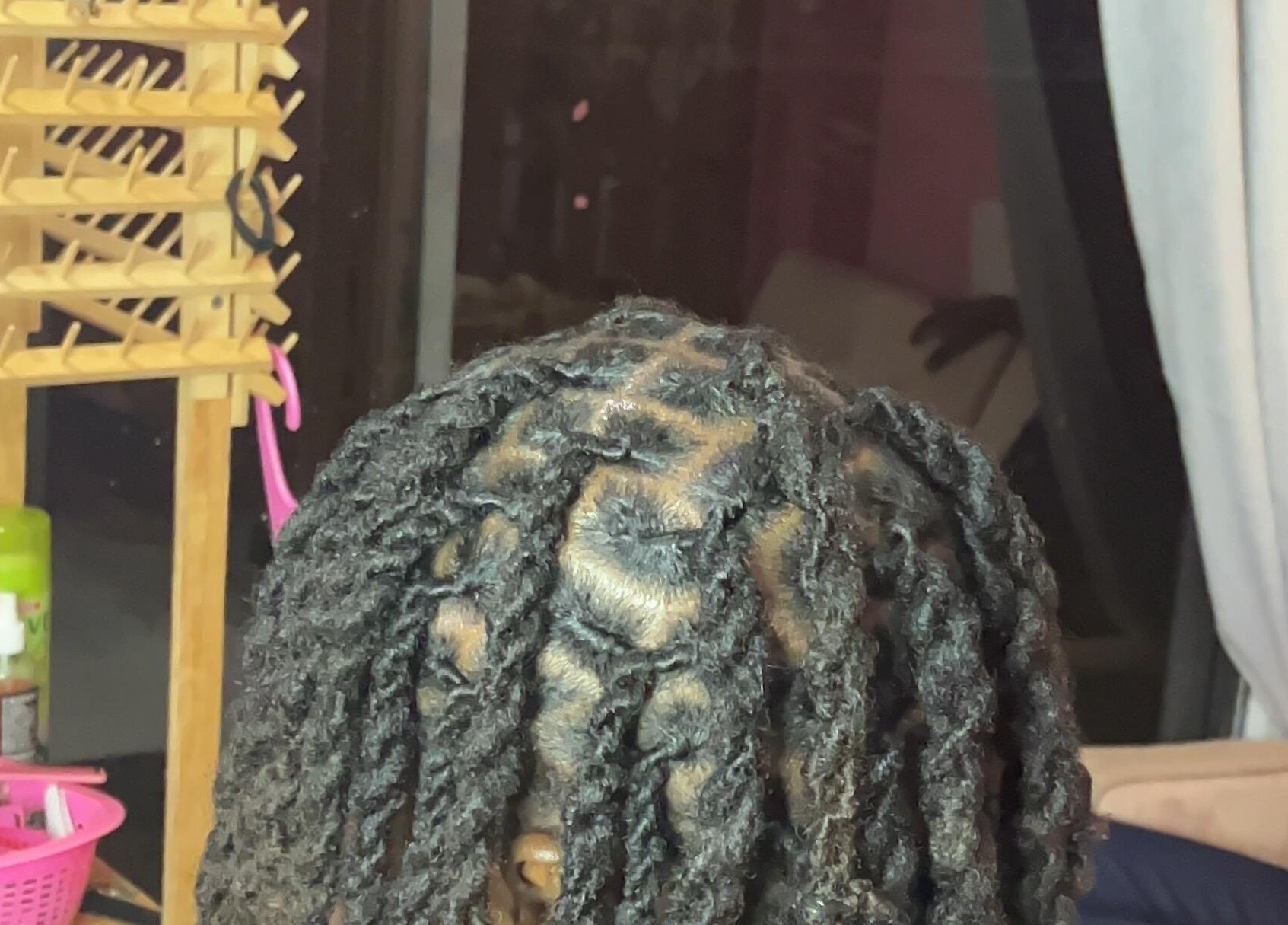 Intricate hair twists at Curl Pride GY, West Bank Demerara, GY showcasing expert styling.