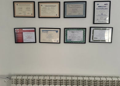 Сертификати на стената в SJ Physio & Pilates, София, Област София, BG, показващи професионализъм.