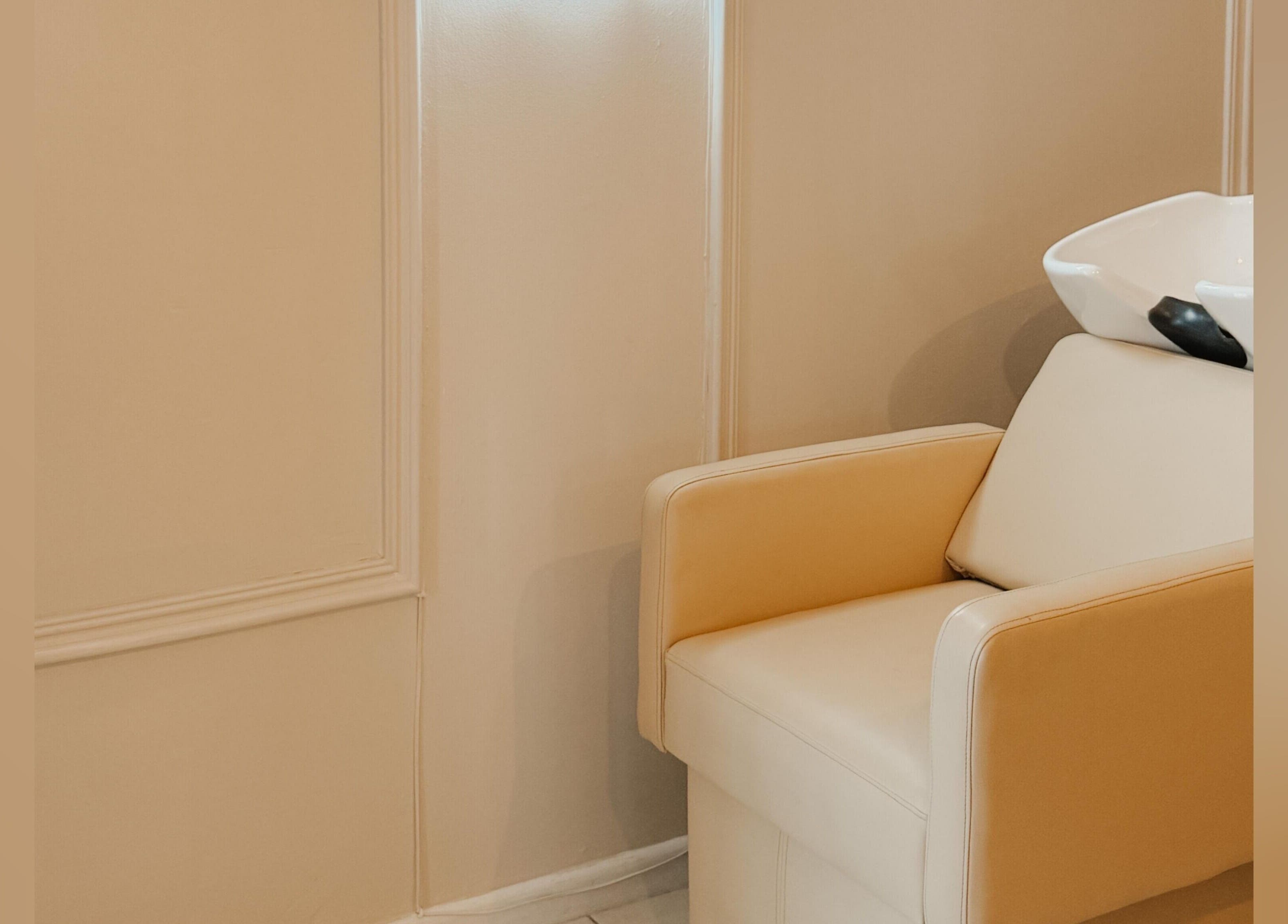 Elegant salon chair at Aesthetic Hair in Stellenbosch, Western Cape, ZA, offering a relaxing experience.