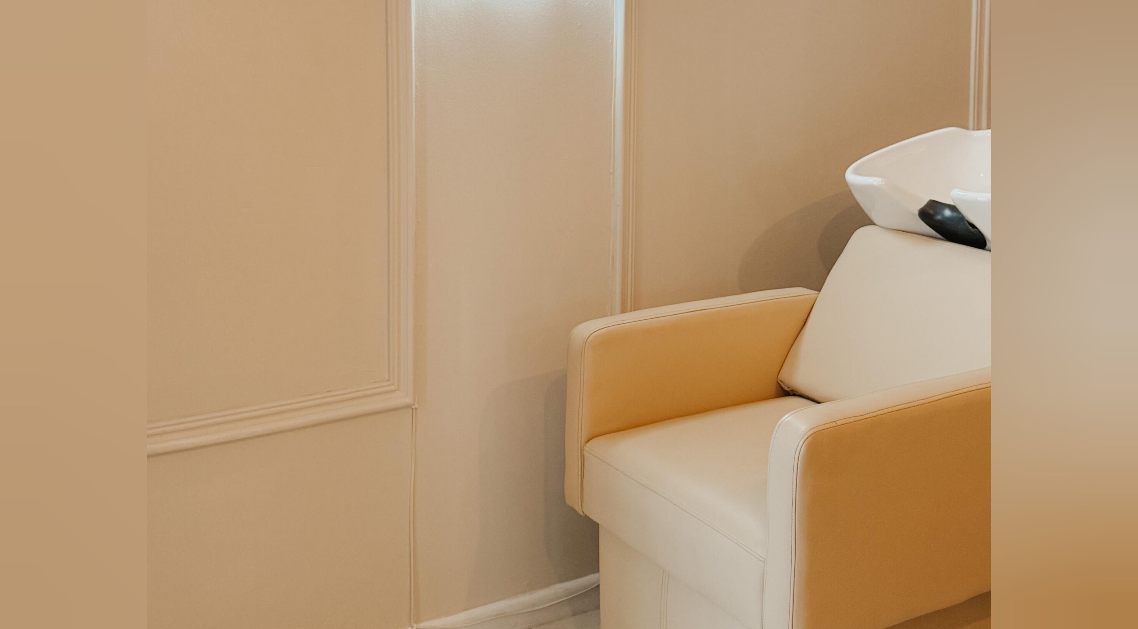 Elegant salon chair at Aesthetic Hair in Stellenbosch, Western Cape, ZA, offering a relaxing experience.