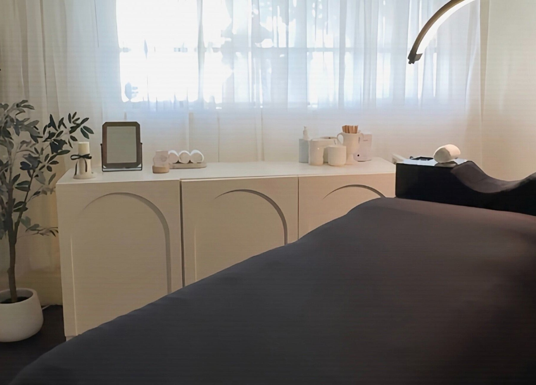 Relaxing treatment room at Studio Silk, Melbourne, Victoria, AU, with a massage table and ambient decor.