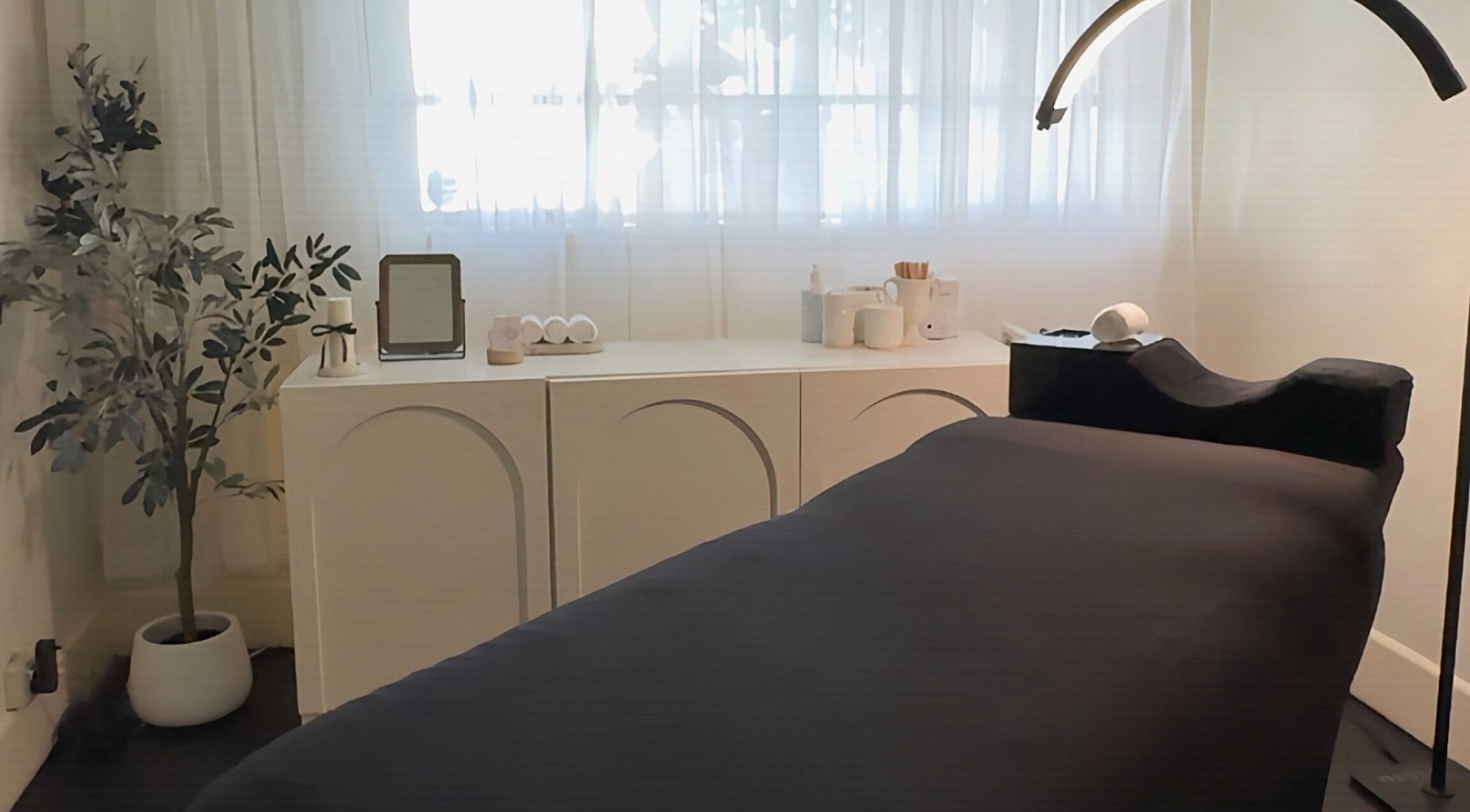 Relaxing treatment room at Studio Silk, Melbourne, Victoria, AU, with a massage table and ambient decor.